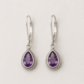 Silver teardrop amethyst earrings with rope-texture bezel and lever hooks