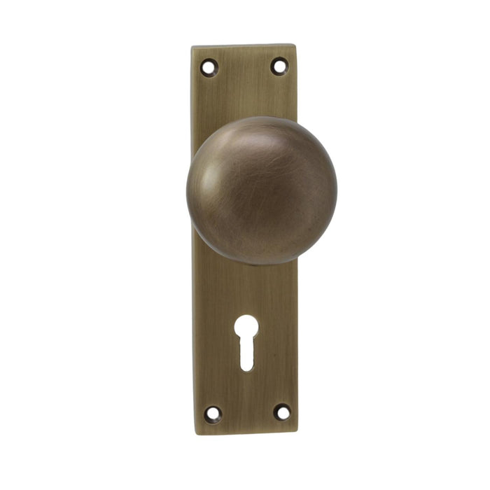 Antique Brass Door Knob on Plate with Two Lever Lock Door Knobs & Handles