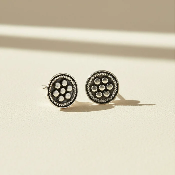 Silver-tone beaded circle stud earrings with six pearl-like dot accents