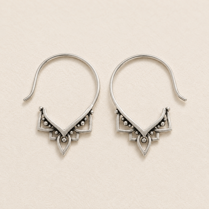 Silver-tone hoop pull-through earrings with ornate triangular beaded detail