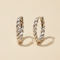Braided huggie hoop earrings in polished silver tone, twisted rope design