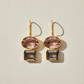 Gold-tone double drop earrings with peach oval top and dark smoky baguette stones