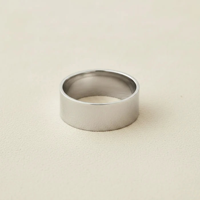 Wide silver-tone cigar band ring with smooth, flat top
