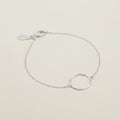 Silver circle charm bracelet with fine chain and small tag clasp