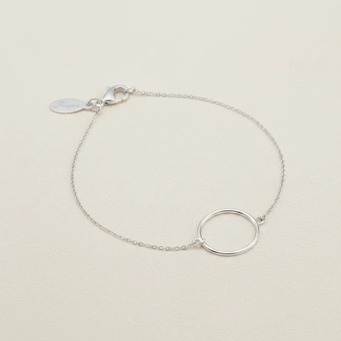 Silver circle charm bracelet with fine chain and small tag clasp