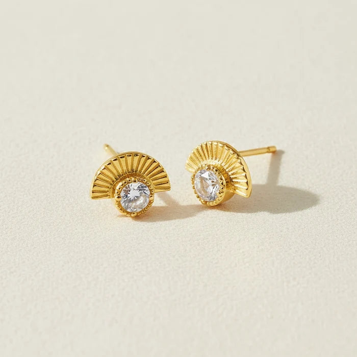 Gold-tone stud earrings with radiant fan design and clear round crystal centers