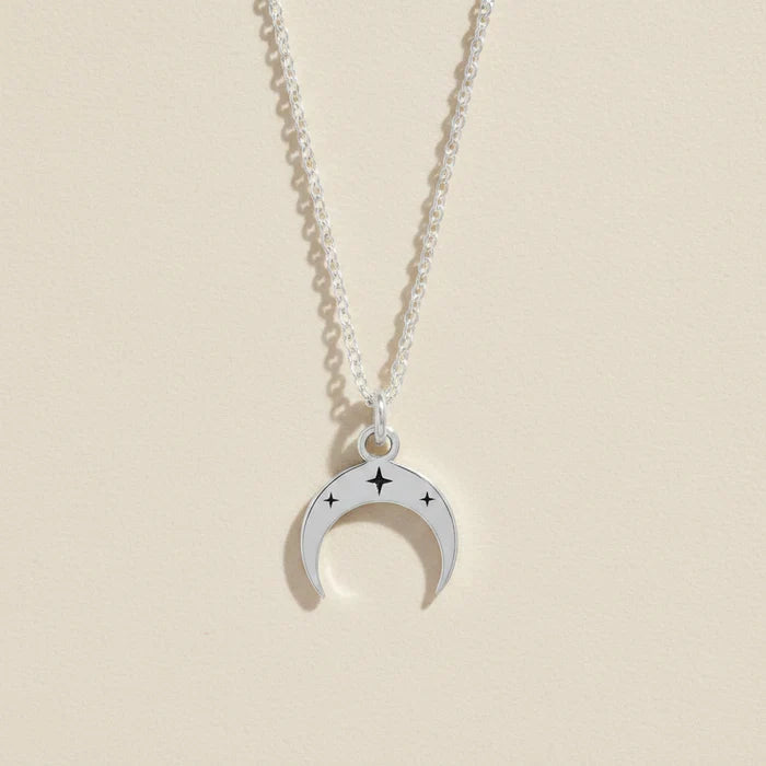 Silver-tone crescent moon necklace with star accents on a linked chain