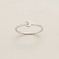 Silver crescent moon ring with smooth open band and small moon-shaped front detail