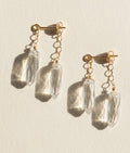 Gold-tone dagger crystal drop earrings with clear faceted prisms and chain links
