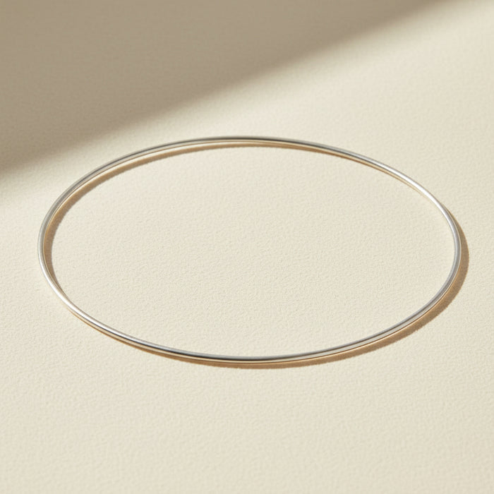 Thin silver bangle bracelet, smooth oval cuff