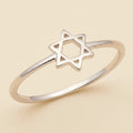 Silver-tone ring with small Star of David charm on open band