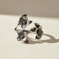 Silver flower ring with three dogwood blossoms and leaves, openwork band