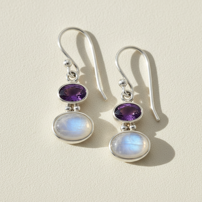 Double oval gemstone dangle earrings with purple top and iridescent white drops, silver-tone