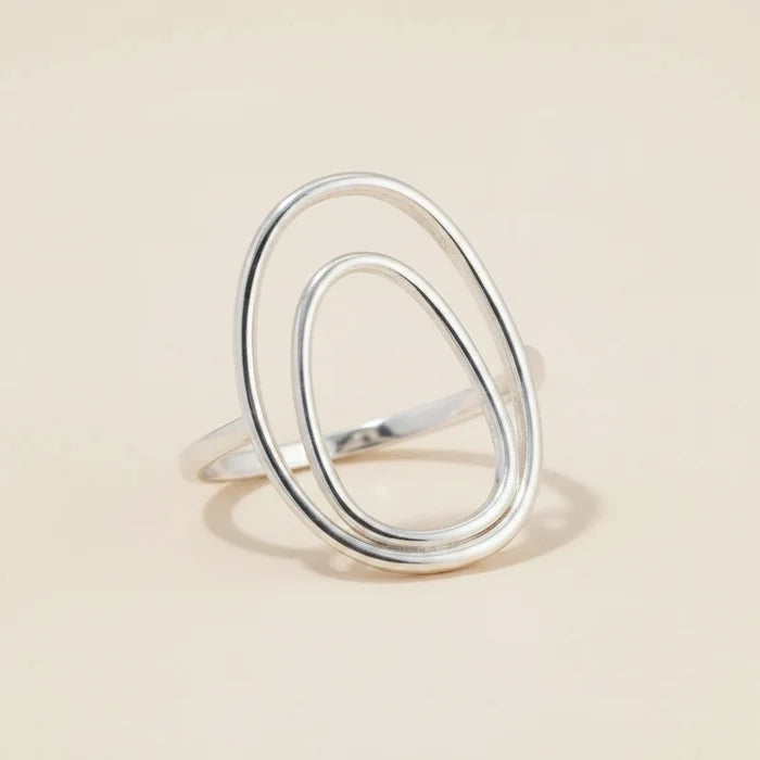 Silver double oval ring with two stacked teardrop-shaped bands