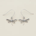 Silver dragonfly dangle earrings with delicate openwork wings and curved hooks.