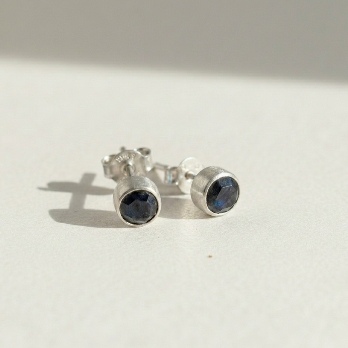 Faceted labradorite stud earrings, round dark blue stones in silver-tone settings