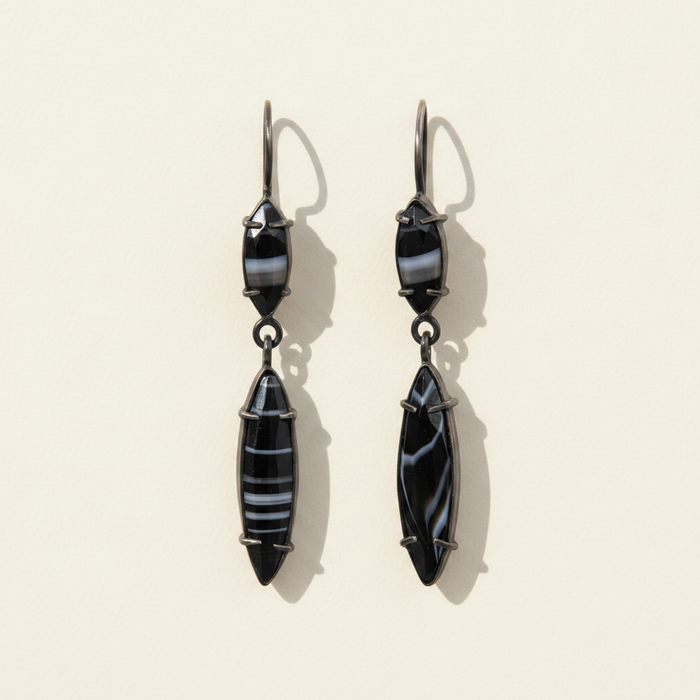 Dark blue marquis drop earrings with faceted geometric dangling charms