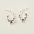 Oxidized filigree hoop earrings with small dangling charms and bead-like details