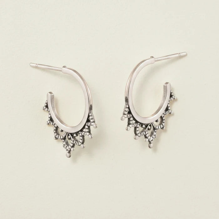 Oxidized filigree hoop earrings with small dangling charms and bead-like details