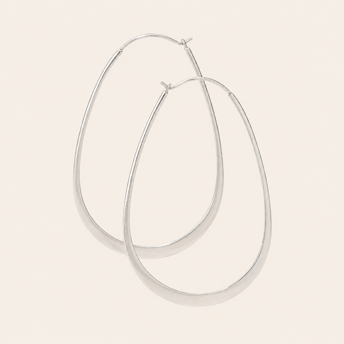 Flat oval hoop earrings, polished silver-tone metal, hinged closure at top