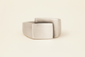 Silver-gray fold-over deco ring with square center face and wide band