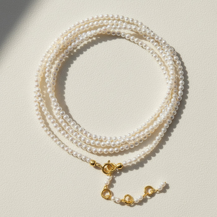 Freshwater pearl wrap bracelet/necklace with gold clasp and layered pearl strands