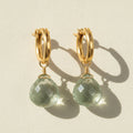 Gold huggie hoop earrings with faceted green amethyst briolette drops