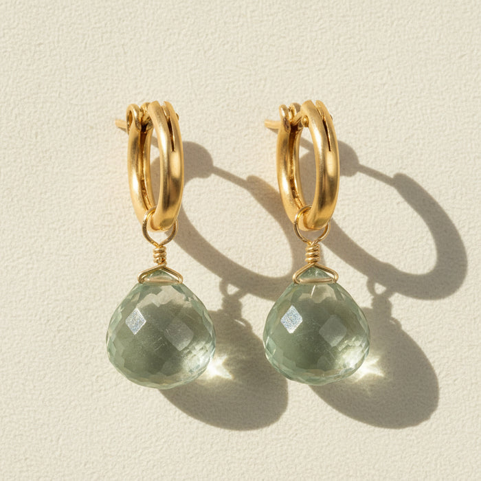 Gold huggie hoop earrings with faceted green amethyst briolette drops
