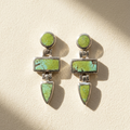 Green turquoise drop earrings with bezel-set round and geometric stone charms