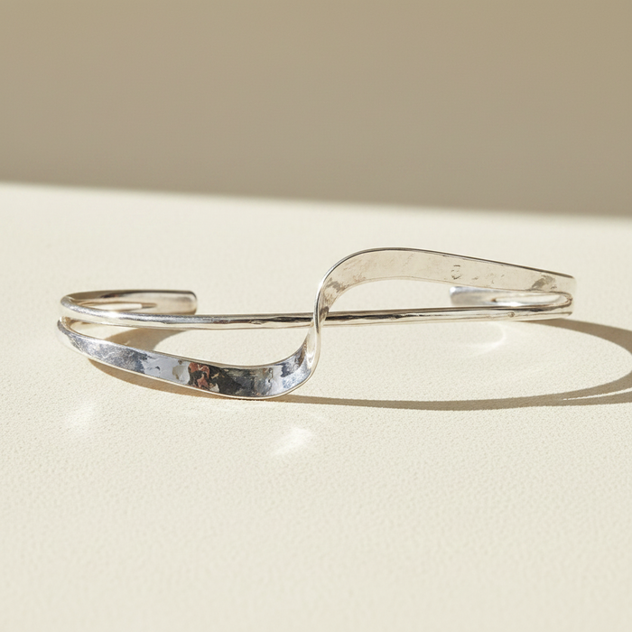 Silver hammered cuff bracelet with double wave design and open ends