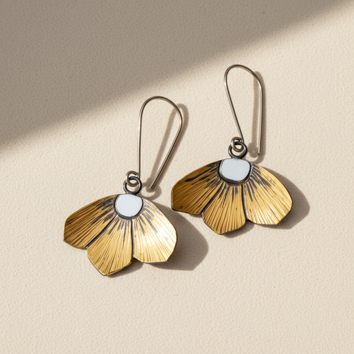 Gold-tone floral drop earrings with silver-toned hooks and light round centers