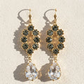 Gold-tone chandelier earrings with dark faceted clusters and teardrop clear crystals