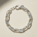 Silver chain bracelet on a white background