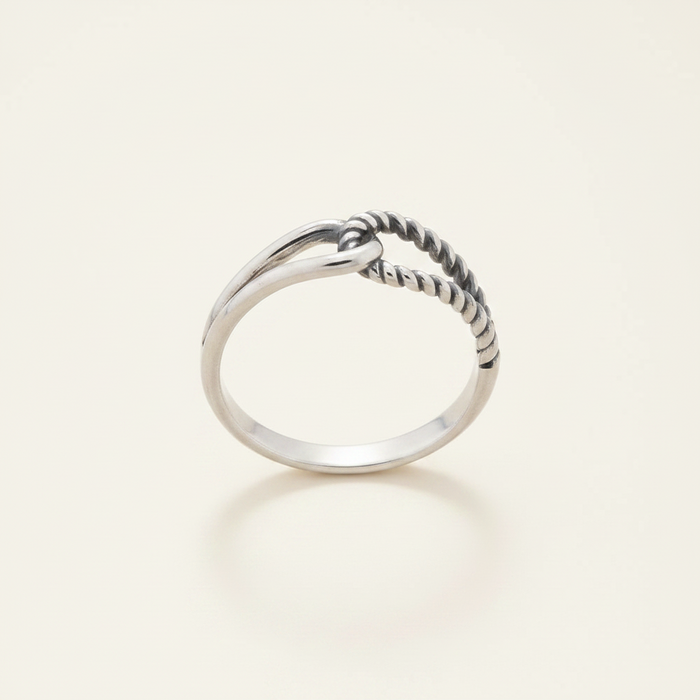 Silver-tone interlocking loops ring, twisted loop across top of polished band
