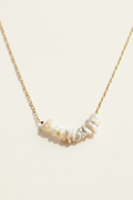 Keishi pearl row necklace, gold chain with white irregular pearls along curve