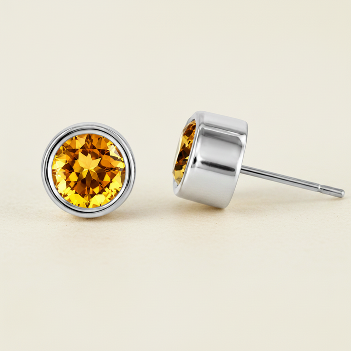 Large round citrine gemstone stud earrings with silver bezel, flat back post.