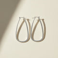 Large silver teardrop hoop earrings with hinge hook closure