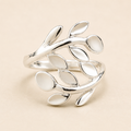 Silver leaf-vine ring with connected oval leaf accents, polished metal band