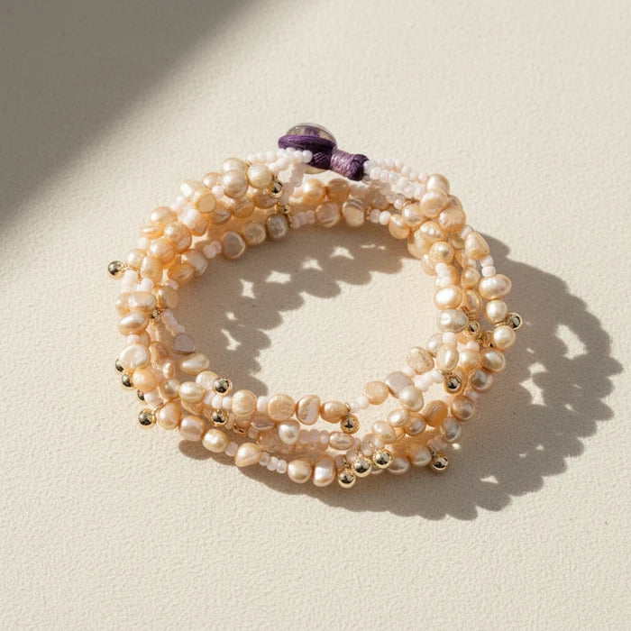 Luminaria beaded pearl bracelet with gold-toned spacers and purple clasp