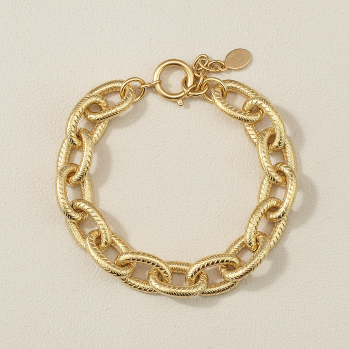 Chunky gold-tone chain bracelet with twisted links and round clasp
