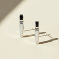Pair of earrings with opal stones on a white background