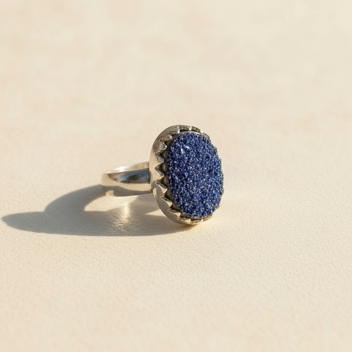 Oval druzy ring with textured blue druzy center and silver-tone shank