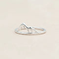 Silver ring with mountain design on a white background