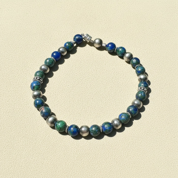 Beaded talisman bracelet with blue, green, and silver round beads