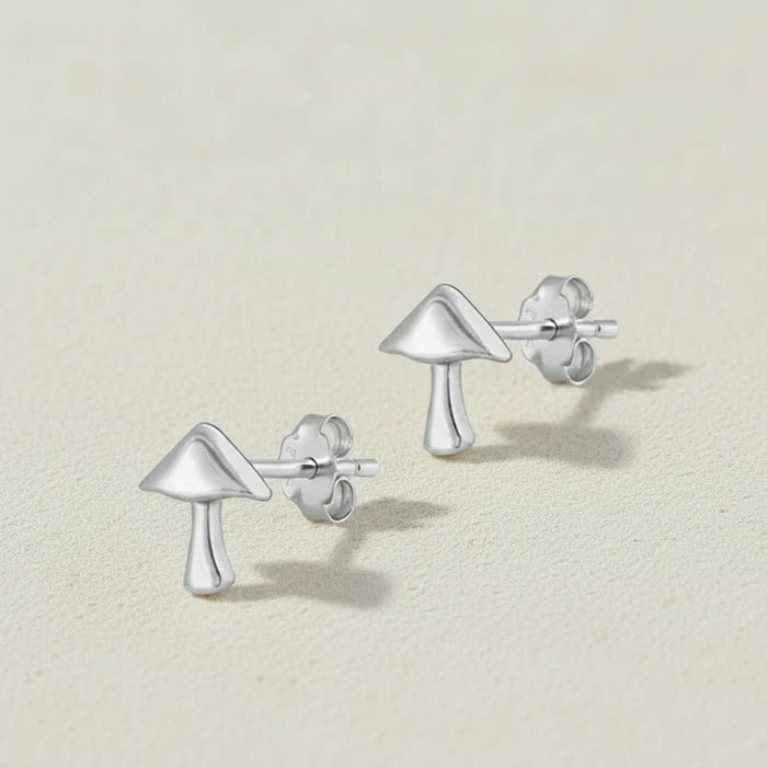 Silver mushroom-shaped stud earrings with butterfly backings