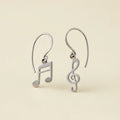 Silver-tone dangle earrings with music note and treble clef charms