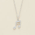 Silver-tone musical note pendant necklace with openwork note charm on a chain