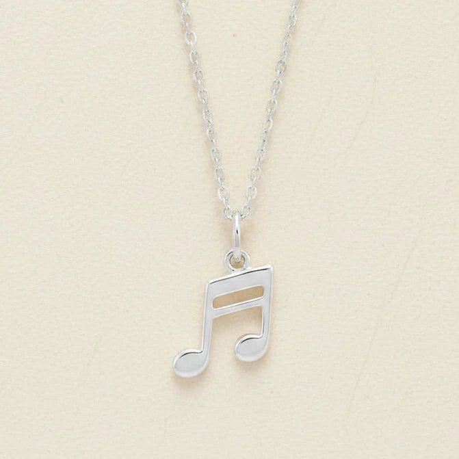Silver-tone musical note pendant necklace with openwork note charm on a chain