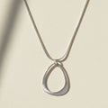 Open drop pendant necklace with open teardrop charm on silver chain