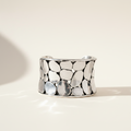 Silver-tone oval pebble-texture ring band, polished metal, wide profile